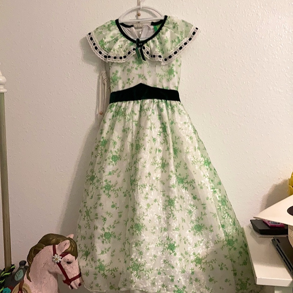This is a Scarlet O’hara dress and sun hat from the movie Gone With The Wind.